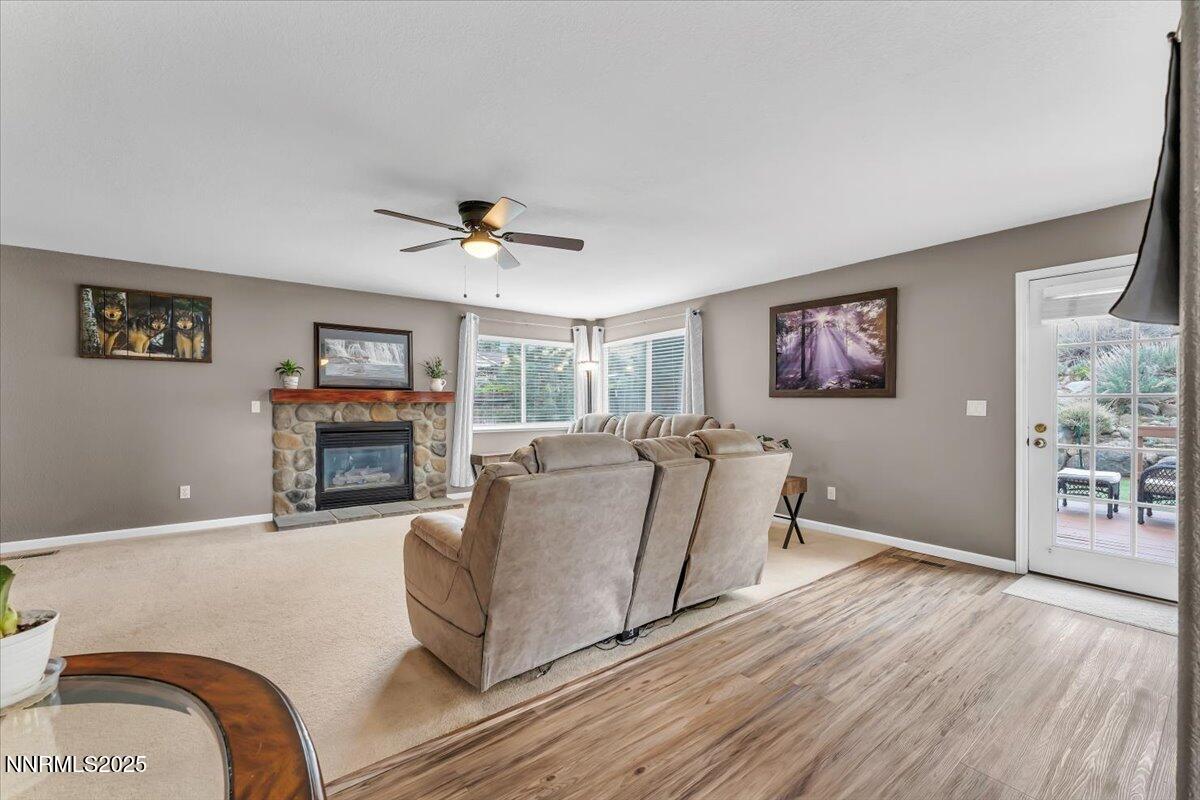 55 Ghost Rider Court Reno, NV 89511 - Photo 13 of 29 a living room with furniture and a fireplace