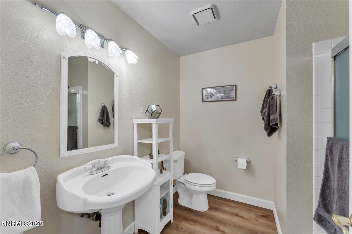 55 Ghost Rider Court Reno, NV 89511 - Photo 14 of 29 a bathroom with a sink toilet and shower