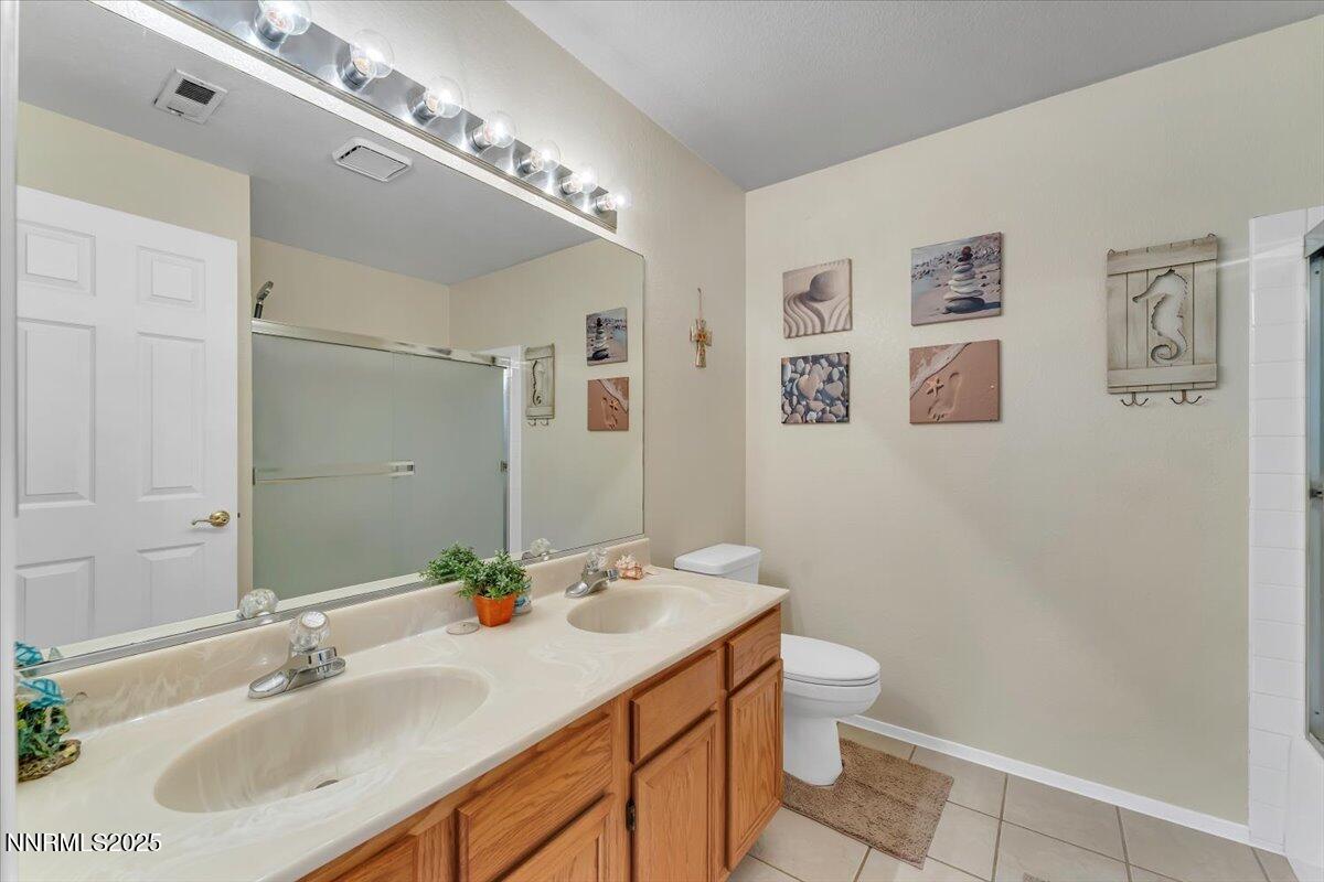 55 Ghost Rider Court Reno, NV 89511 - Photo 20 of 29 a bathroom with a sink and a mirror
