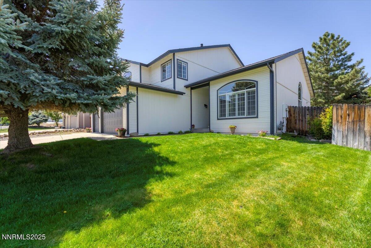 55 Ghost Rider Court Reno, NV 89511 - Photo 2 of 29 a front view of house with yard and green space