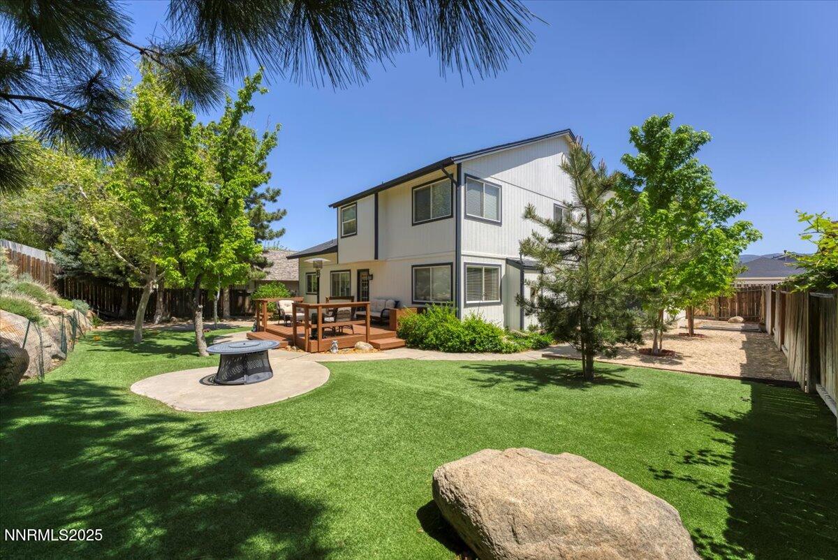 55 Ghost Rider Court Reno, NV 89511 - Photo 24 of 29 a view of a house with backyard and sitting area