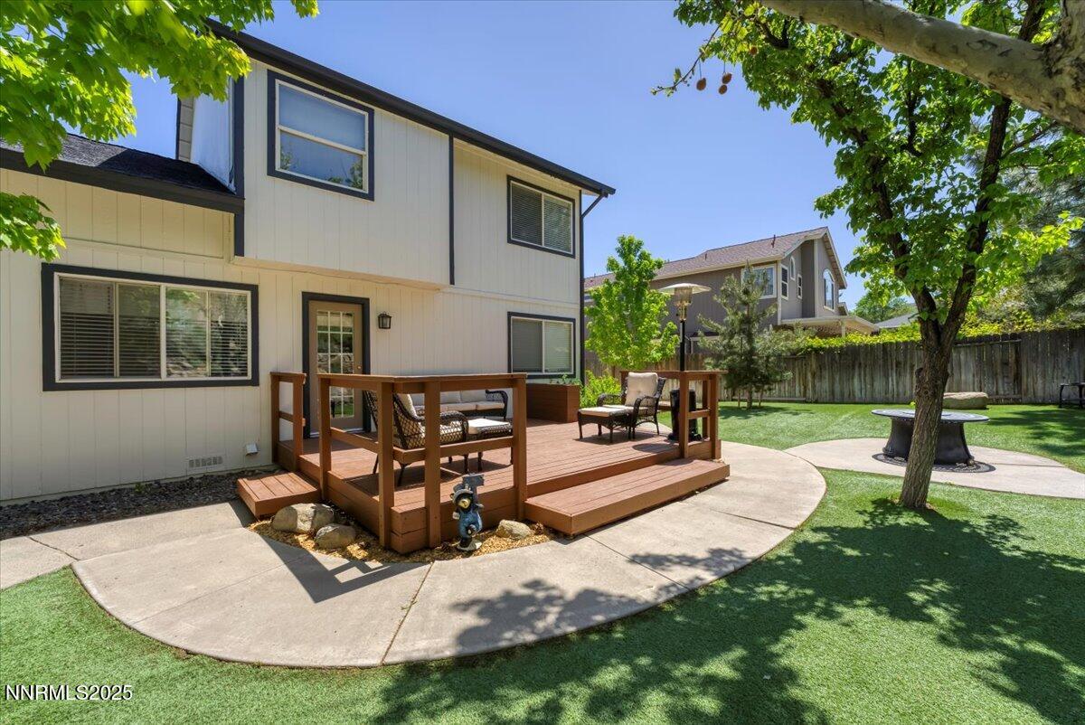 55 Ghost Rider Court Reno, NV 89511 - Photo 25 of 29 a view of a house with backyard porch and sitting area