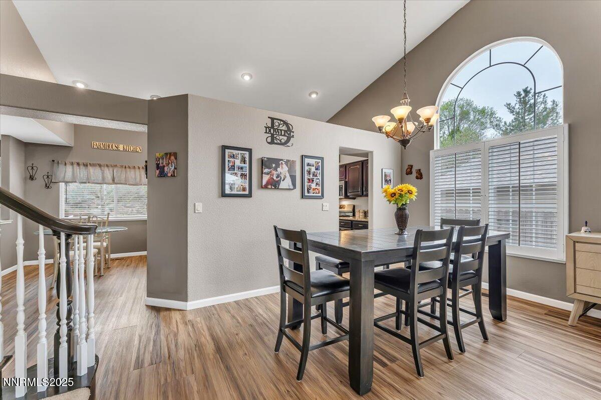 55 Ghost Rider Court Reno, NV 89511 - Photo 7 of 29 a view of a dining room with furniture window and wooden floor