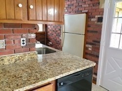 259 Massasoit Road Worcester, MA 01604 - Photo 15 of 23 a kitchen with a refrigerator and countertop