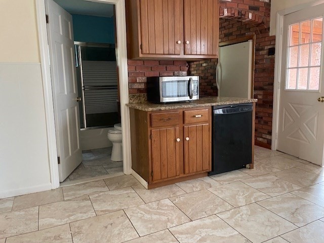 259 Massasoit Road Worcester, MA 01604 - Photo 17 of 23 a kitchen with stainless steel appliances granite countertop a refrigerator and a stove