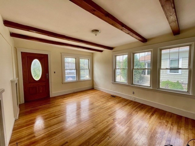 259 Massasoit Road Worcester, MA 01604 - Photo 2 of 23 a view of an empty room with wooden floor and a window