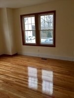 259 Massasoit Road Worcester, MA 01604 - Photo 3 of 23 a view of empty room with wooden floor and fan