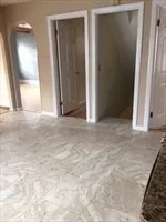 an empty room with closet and mirror