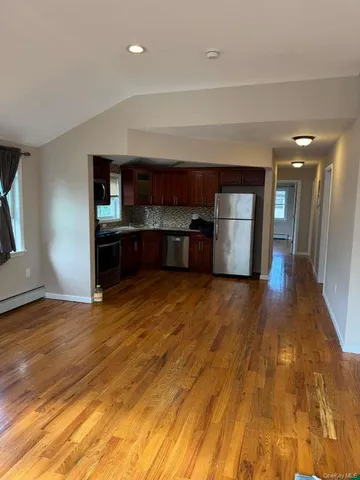 a kitchen with stainless steel appliances granite countertop a sink and a stove top oven