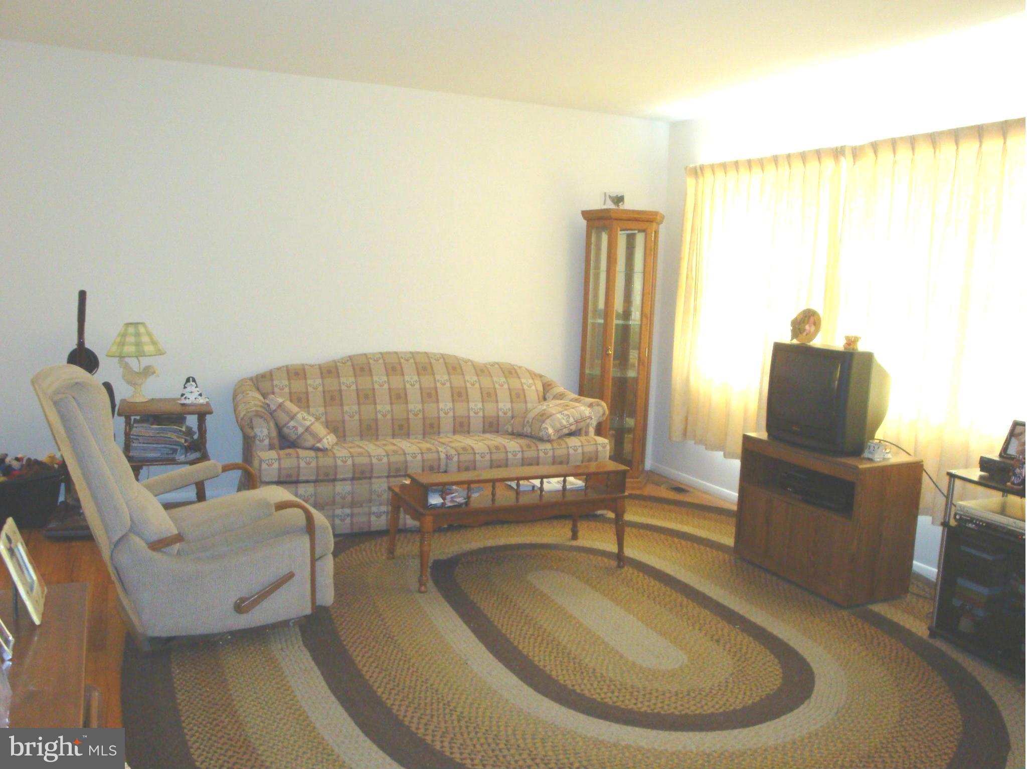 713 Tupelo Road Edgewood, MD 21040 - Photo 3 of 18 a living room with furniture and a large window