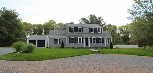 1500 South County Road Barnstable, MA 02655 - Photo 1 of 30 a front view of a house with a garden