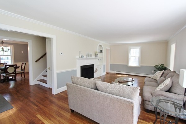 1500 South County Road Barnstable, MA 02655 - Photo 18 of 30 a living room with furniture and a fireplace
