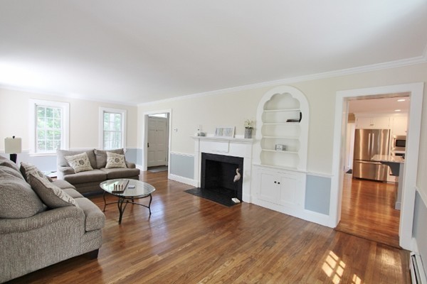 1500 South County Road Barnstable, MA 02655 - Photo 20 of 30 a living room with furniture and a fireplace
