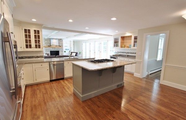 1500 South County Road Barnstable, MA 02655 - Photo 2 of 30 a kitchen with a sink a stove a refrigerator and white cabinets
