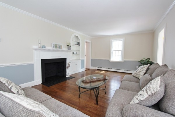 1500 South County Road Barnstable, MA 02655 - Photo 21 of 30 a living room with furniture and a fireplace