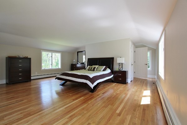 1500 South County Road Barnstable, MA 02655 - Photo 25 of 30 a spacious bedroom with a bed and a closet