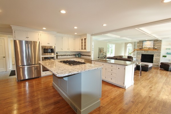 1500 South County Road Barnstable, MA 02655 - Photo 3 of 30 a kitchen with a refrigerator sink and cabinets
