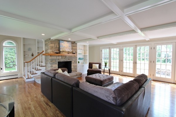 1500 South County Road Barnstable, MA 02655 - Photo 6 of 30 a living room with furniture a large window and a fireplace