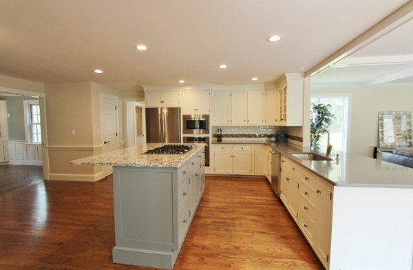 1500 South County Road Barnstable, MA 02655 - Photo 9 of 30 a large kitchen with stainless steel appliances lots of counter space and wooden floor