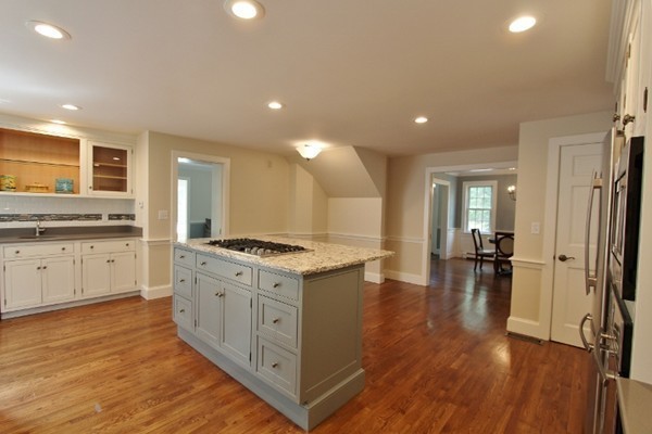 1500 South County Road Barnstable, MA 02655 - Photo 10 of 30 a large kitchen with stainless steel appliances granite countertop a lot of counter space and wooden floor