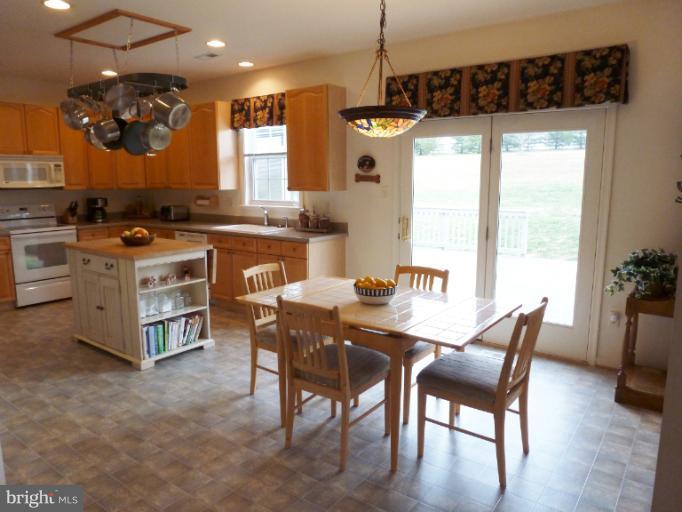 1999 Long Corner Road Mount Airy, MD 21771 - Photo 2 of 27 a view of a dining room with furniture window and wooden floor