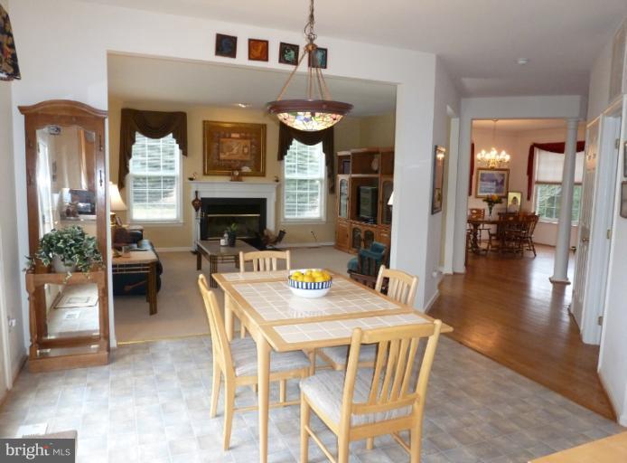 1999 Long Corner Road Mount Airy, MD 21771 - Photo 16 of 27 a view of a dining room with furniture window and wooden floor