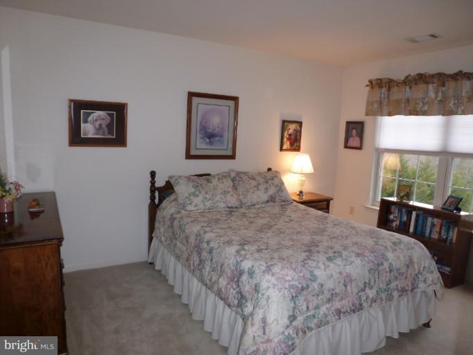 1999 Long Corner Road Mount Airy, MD 21771 - Photo 17 of 27 a bedroom with a bed and a window