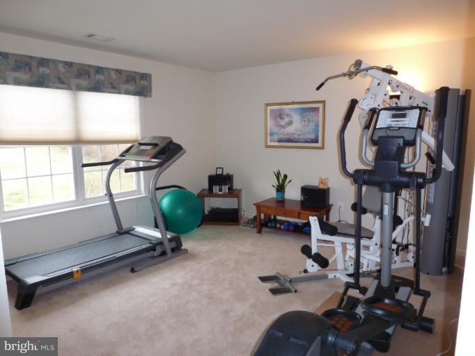 1999 Long Corner Road Mount Airy, MD 21771 - Photo 21 of 27 a room with gym equipment and a large window