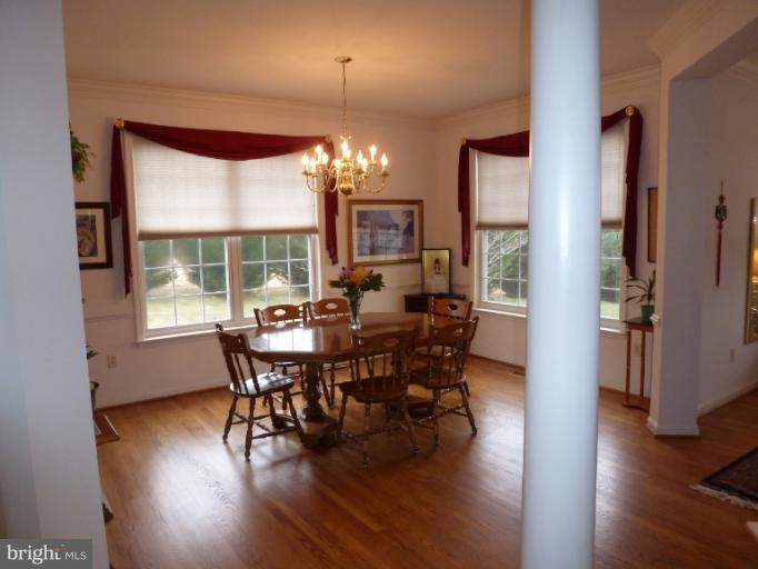 1999 Long Corner Road Mount Airy, MD 21771 - Photo 10 of 27 a view of a dining room with furniture window and wooden floor
