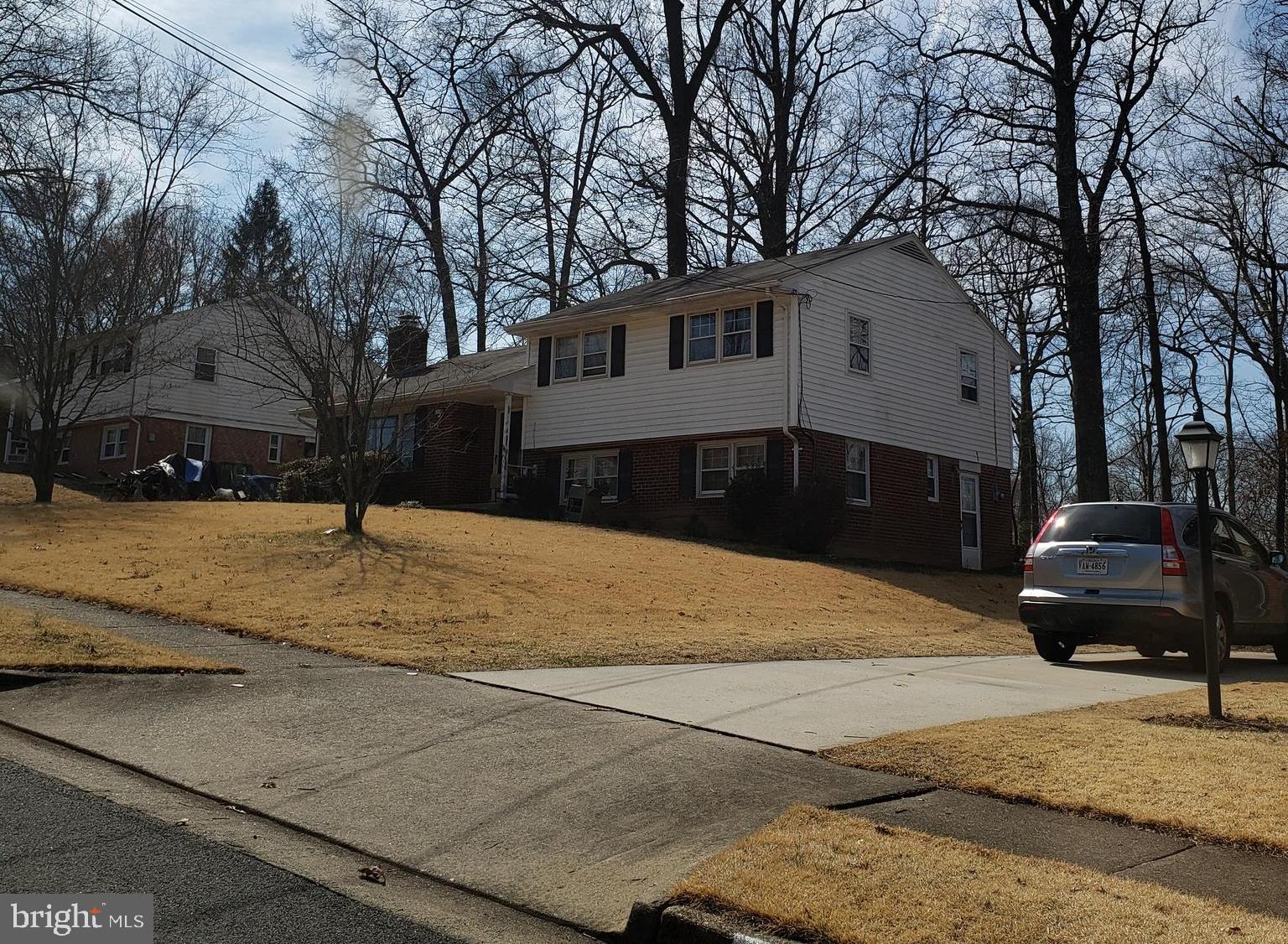 5405 Moultrie Road Springfield, VA 22151 - Photo 2 of 9 a front view of a house with a yard
