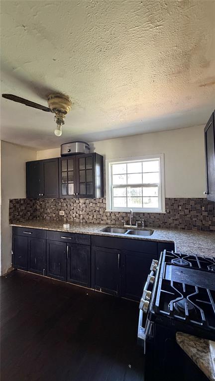 4504 Almena Road River Oaks, TX 76114 - Photo 3 of 4 a kitchen with sink a stove and chairs
