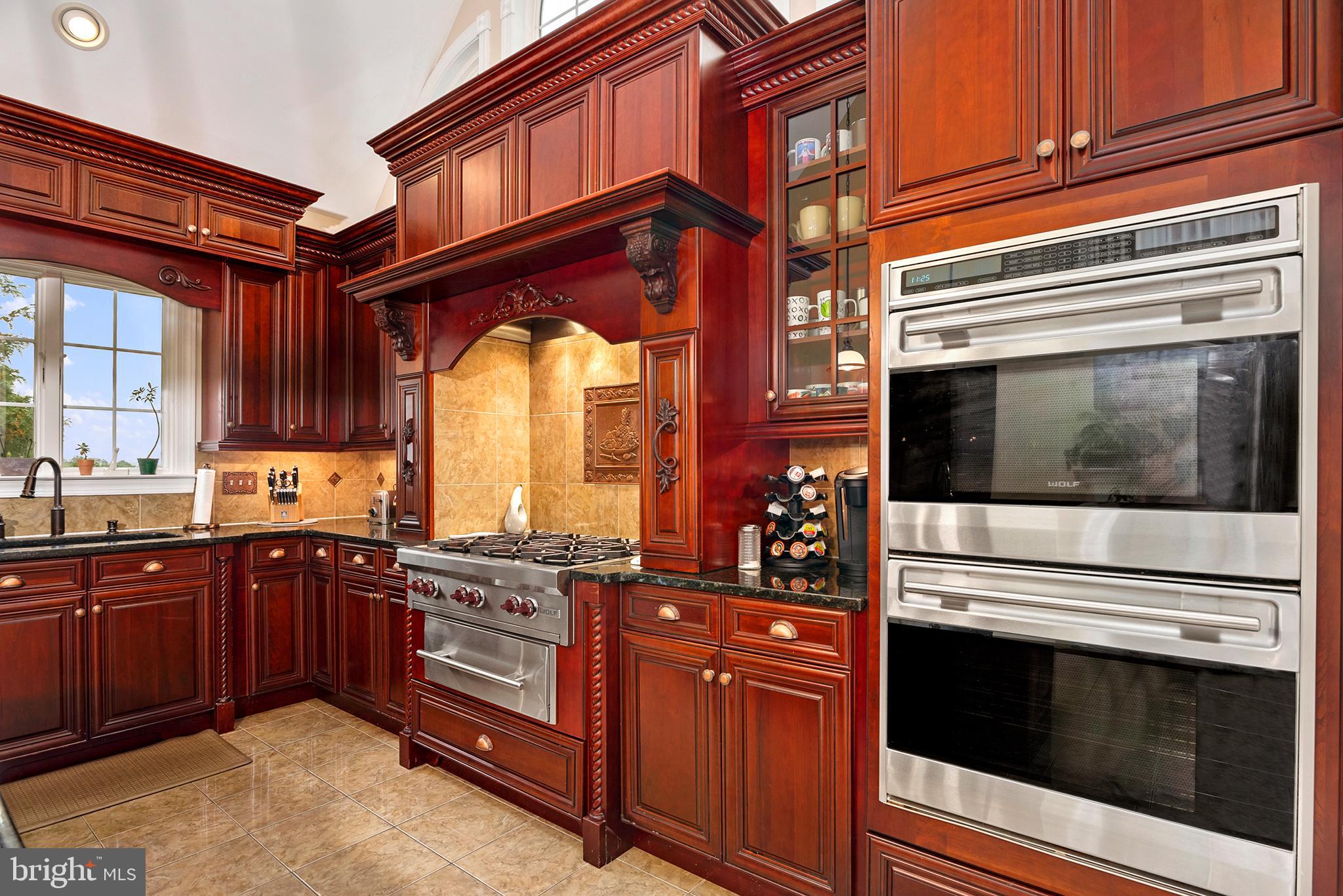 74 Lake Forest Drive Elkton, MD 21921 - Photo 11 of 65 a kitchen with stainless steel appliances granite countertop a stove and a microwave