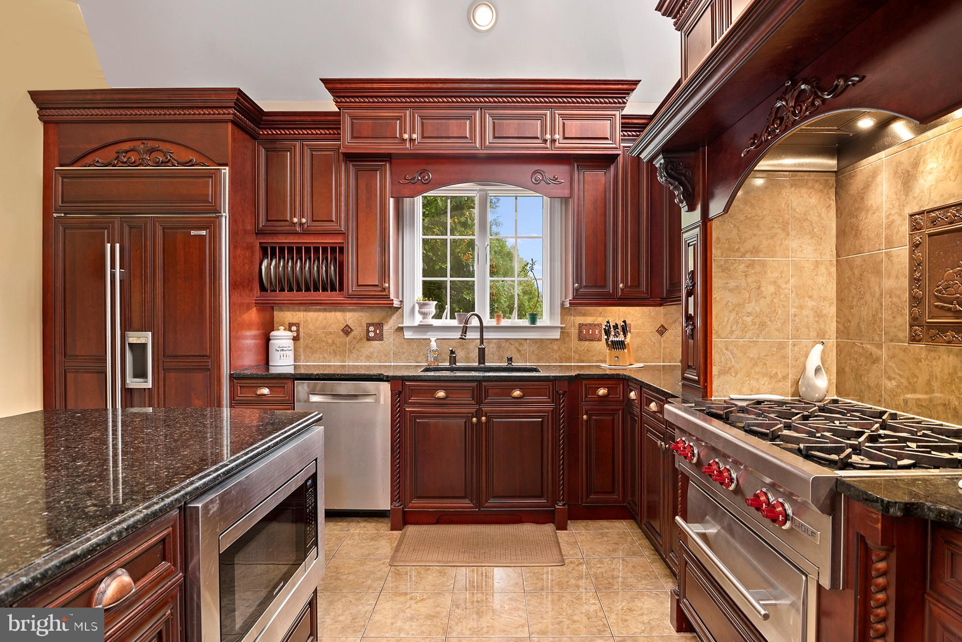 74 Lake Forest Drive Elkton, MD 21921 - Photo 12 of 65 a kitchen with stainless steel appliances granite countertop a stove a sink and a microwave