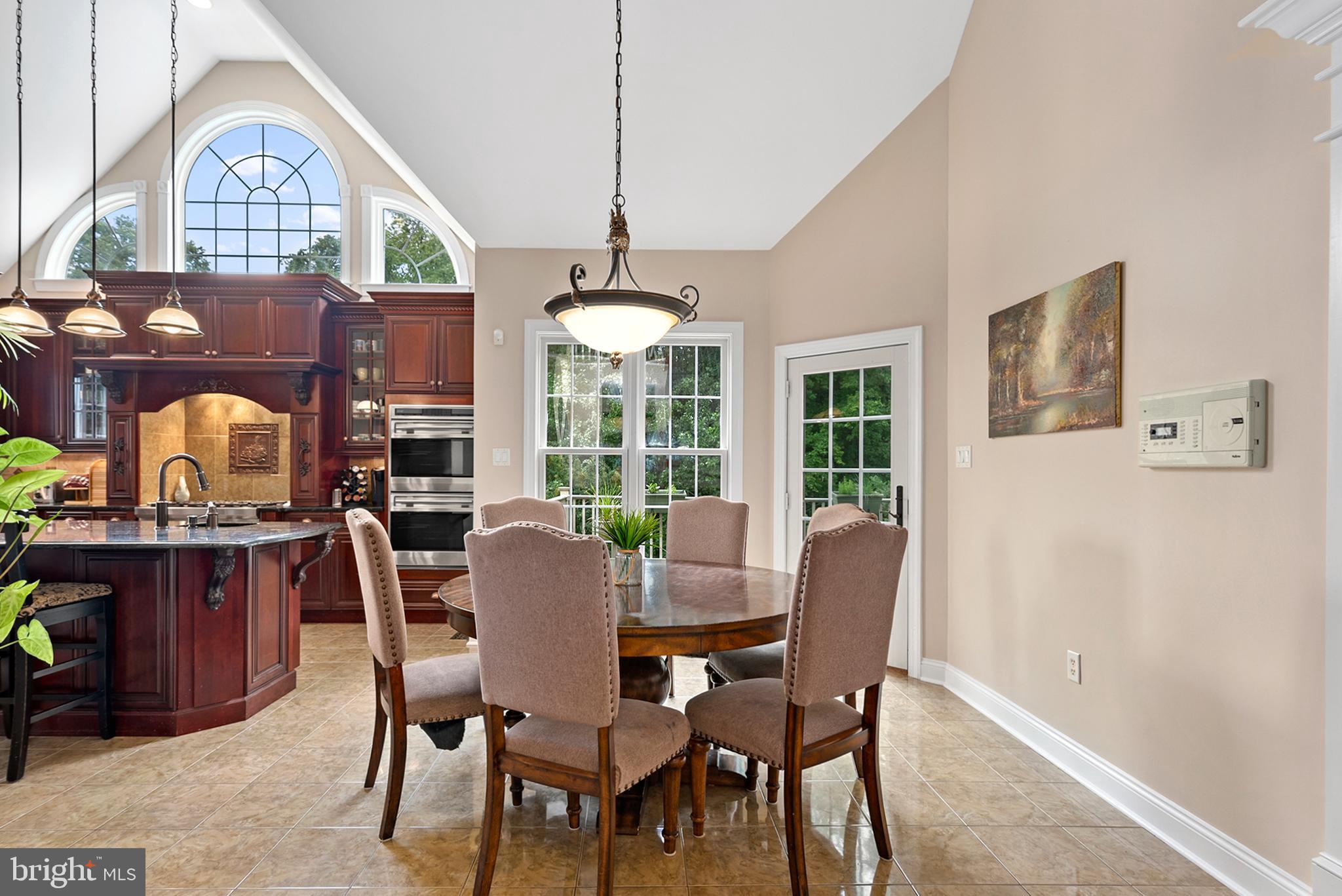 74 Lake Forest Drive Elkton, MD 21921 - Photo 14 of 65 a dining room with furniture a chandelier and wooden floor