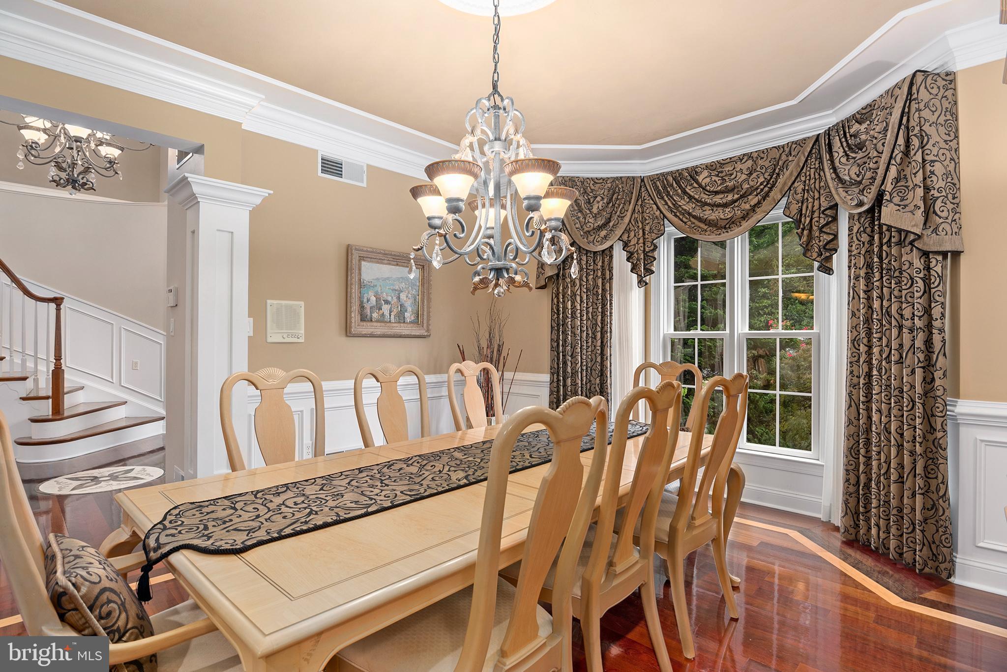 74 Lake Forest Drive Elkton, MD 21921 - Photo 23 of 65 a view of a dining room with furniture and chandelier