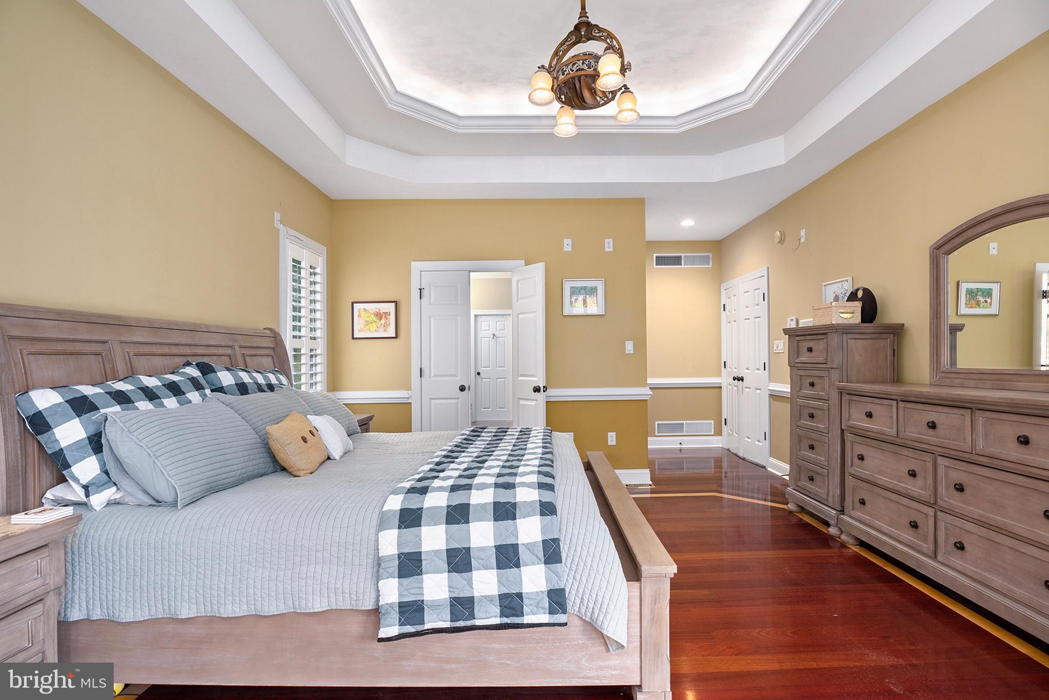 74 Lake Forest Drive Elkton, MD 21921 - Photo 27 of 65 a bedroom with a bed and wooden floor