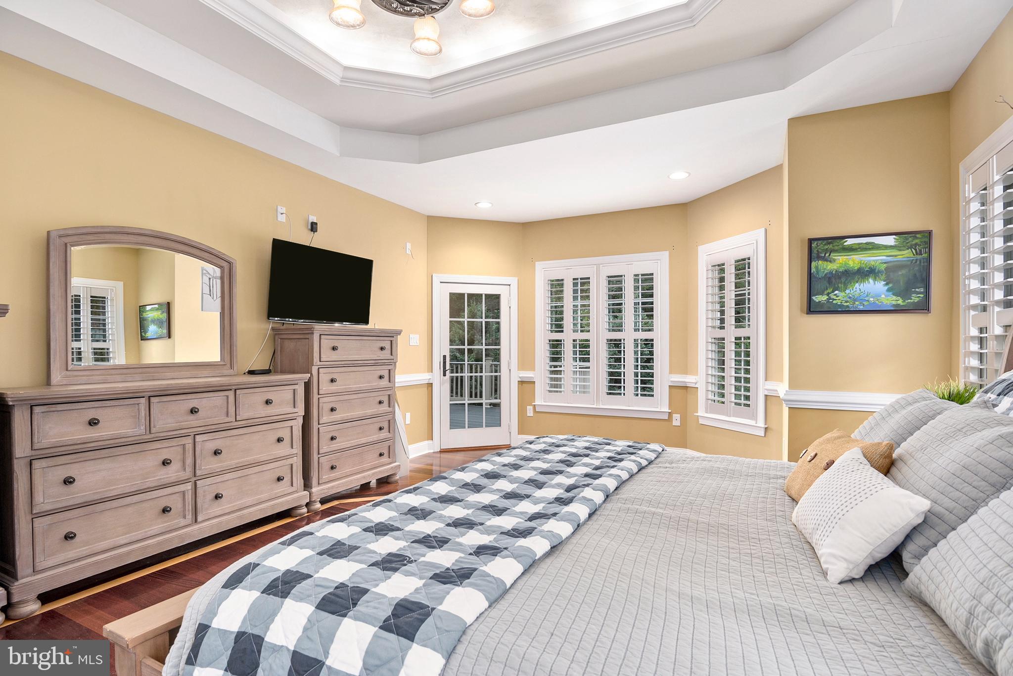 74 Lake Forest Drive Elkton, MD 21921 - Photo 28 of 65 a bedroom with a bed and a flat screen television