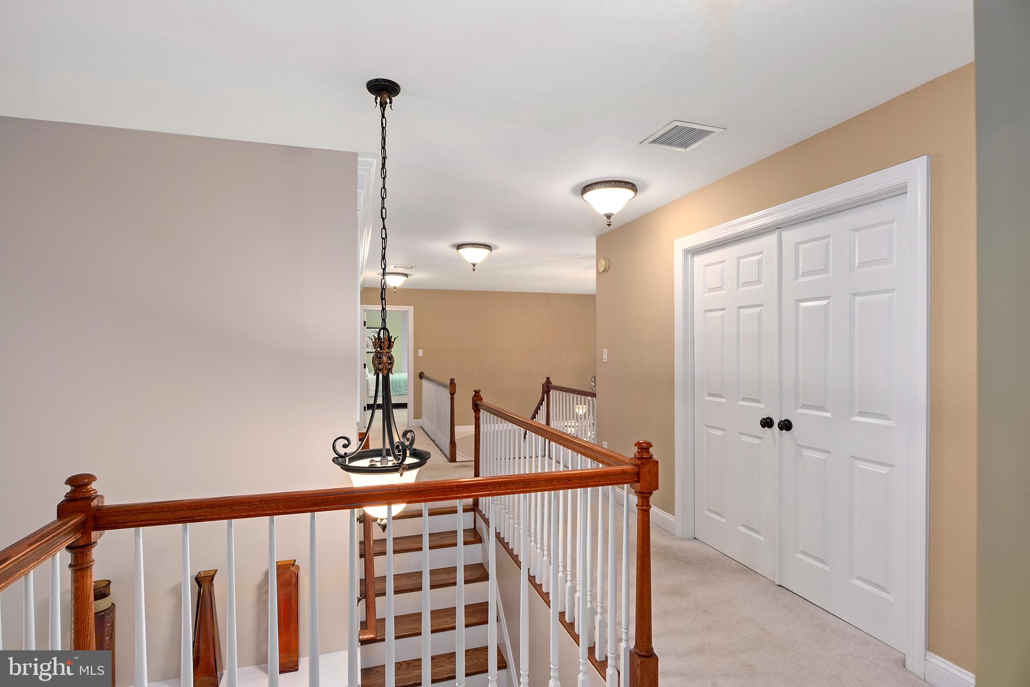 74 Lake Forest Drive Elkton, MD 21921 - Photo 36 of 65 a view of a hallway with wooden floor and stairs
