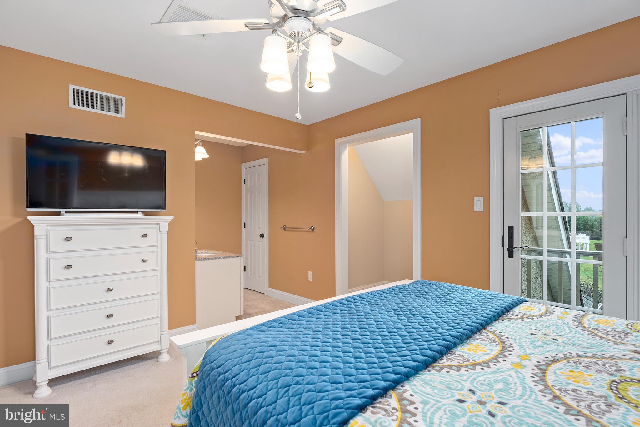 74 Lake Forest Drive Elkton, MD 21921 - Photo 39 of 65 a bedroom with a bed and a flat screen tv