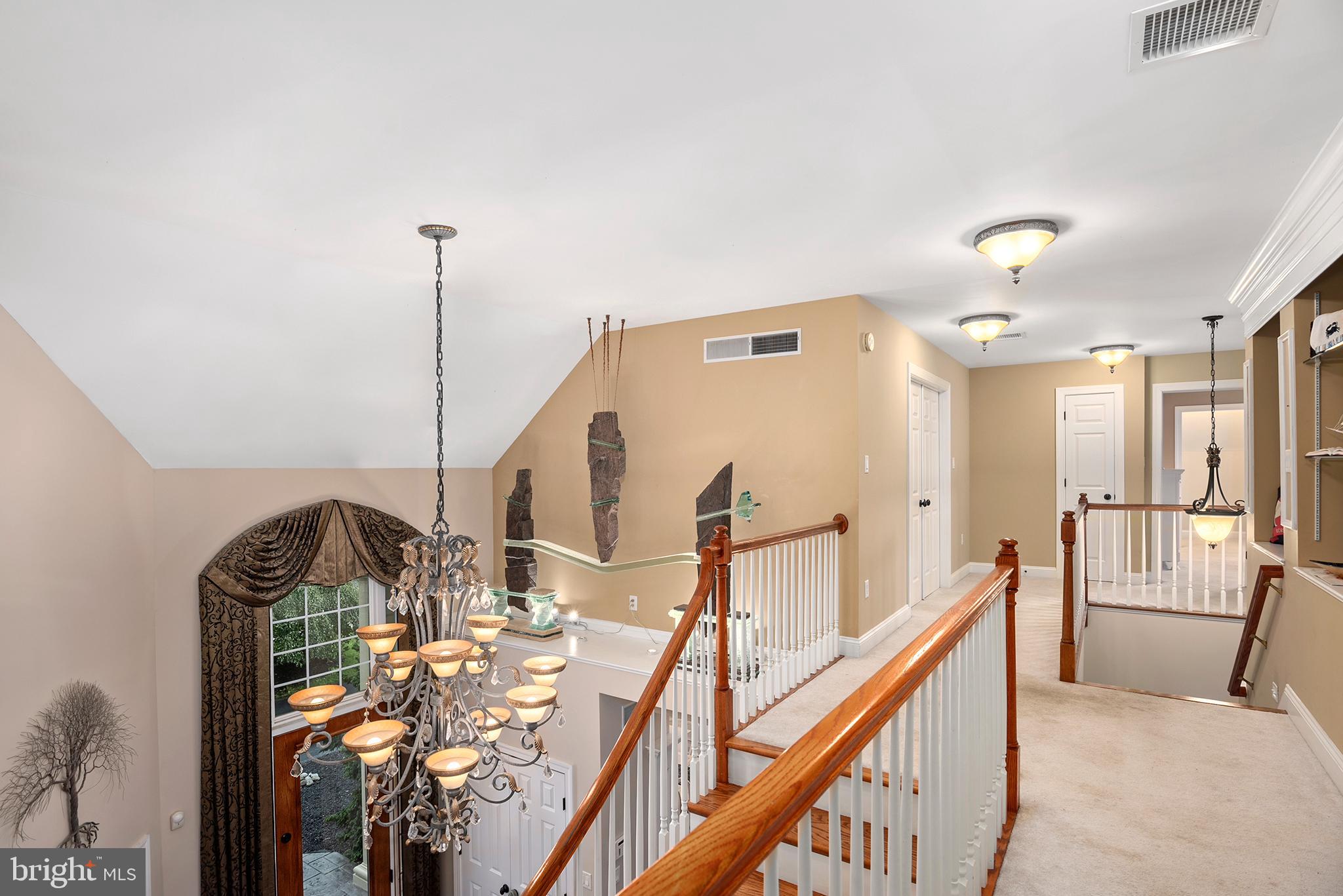 74 Lake Forest Drive Elkton, MD 21921 - Photo 44 of 65 a very nice looking room with a large window and chandelier