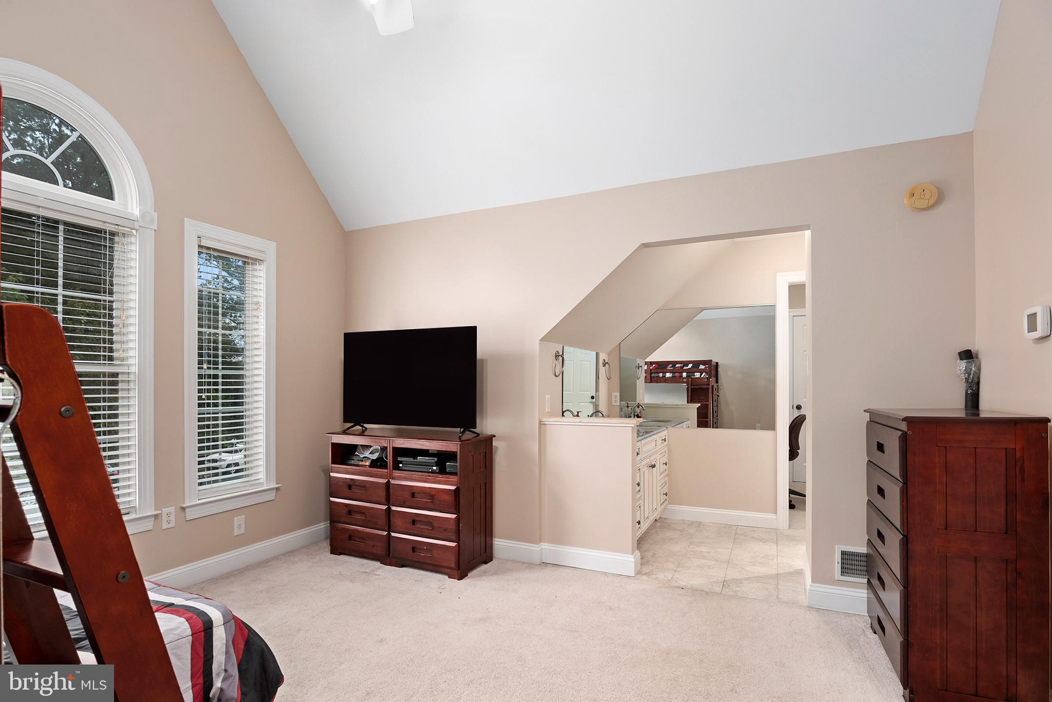 74 Lake Forest Drive Elkton, MD 21921 - Photo 51 of 65 a living room with furniture and a flat screen tv