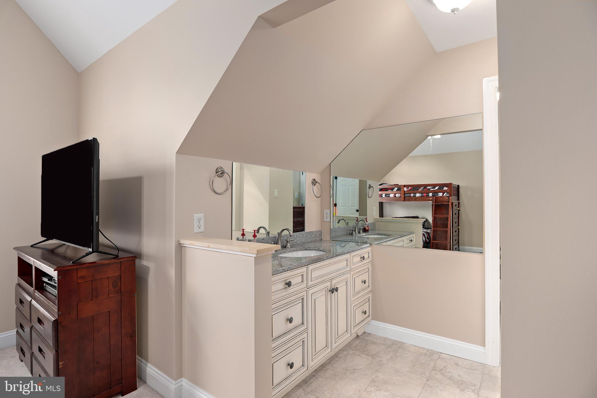 74 Lake Forest Drive Elkton, MD 21921 - Photo 52 of 65 a kitchen with stainless steel appliances granite countertop a sink stove and refrigerator
