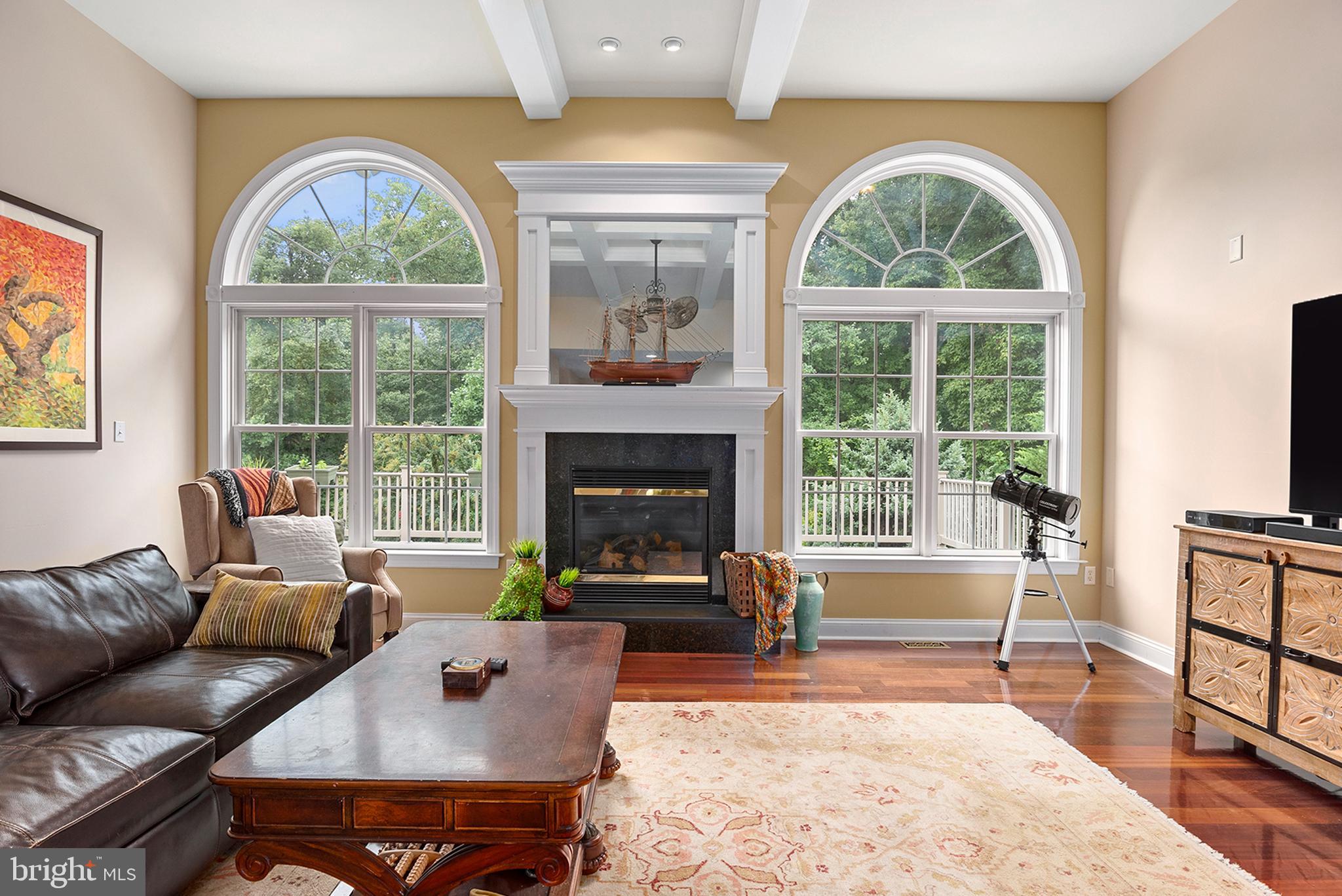 74 Lake Forest Drive Elkton, MD 21921 - Photo 7 of 65 a living room with furniture a fireplace and a large window