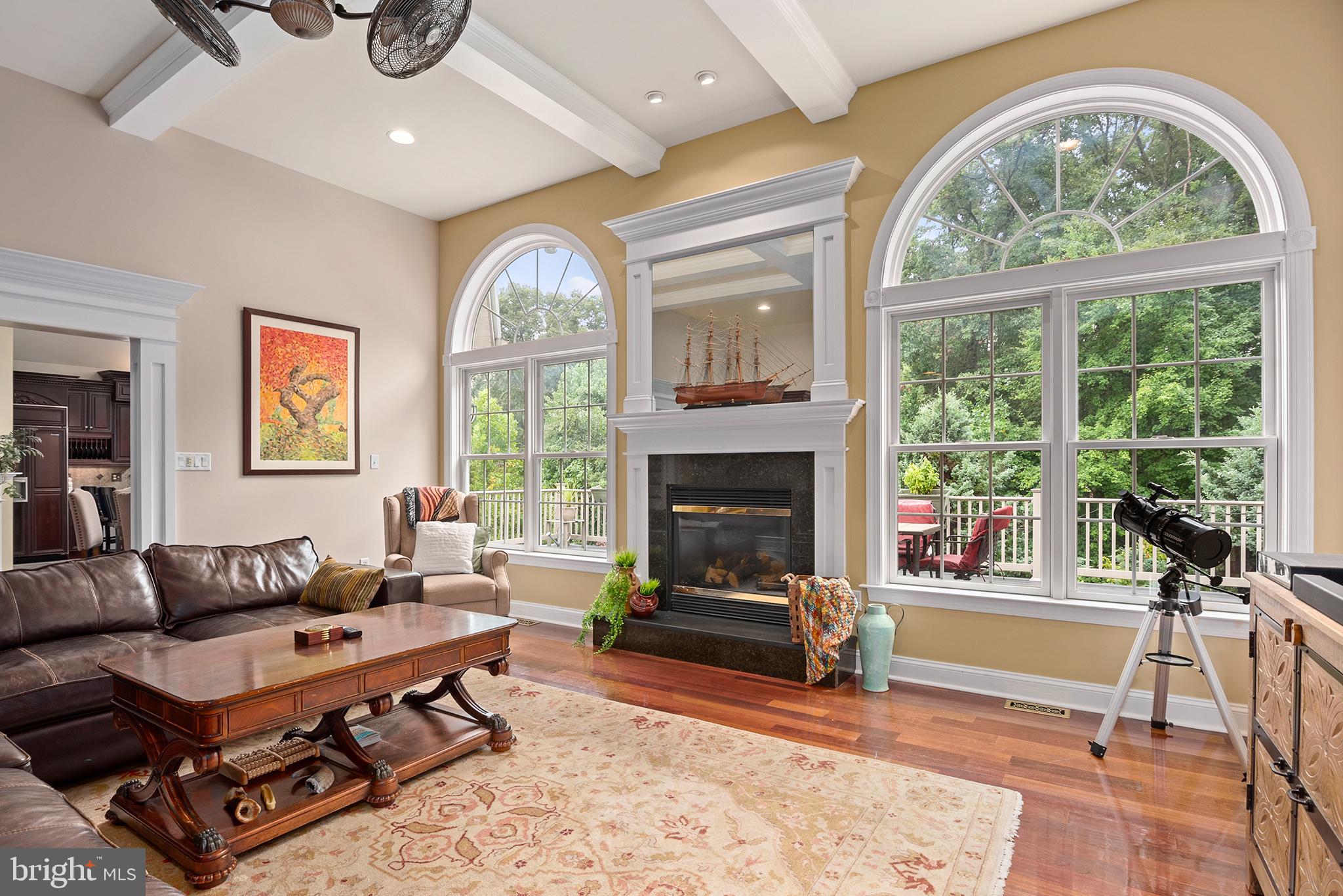 74 Lake Forest Drive Elkton, MD 21921 - Photo 8 of 65 a living room with furniture a fireplace and a large window