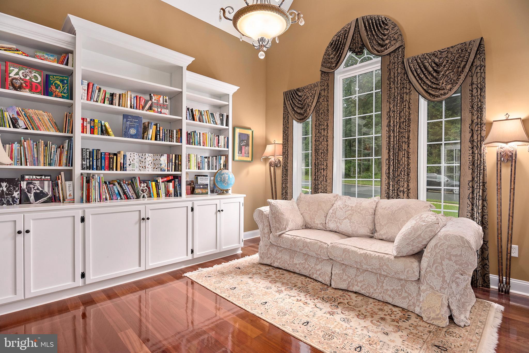 74 Lake Forest Drive Elkton, MD 21921 - Photo 9 of 65 a living room with furniture cabinets and a book shelf
