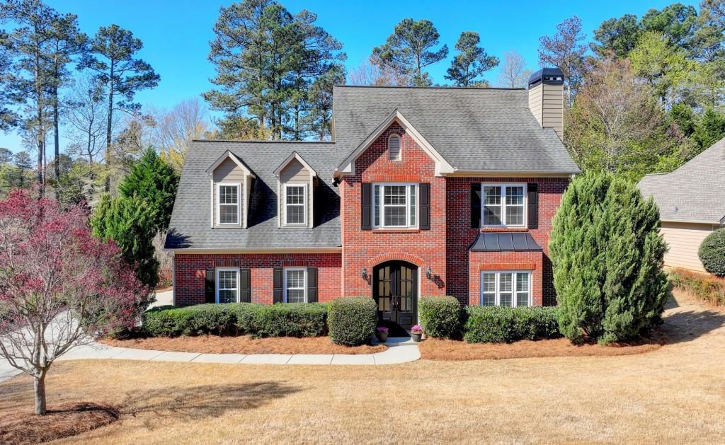 a front view of a house with a yard