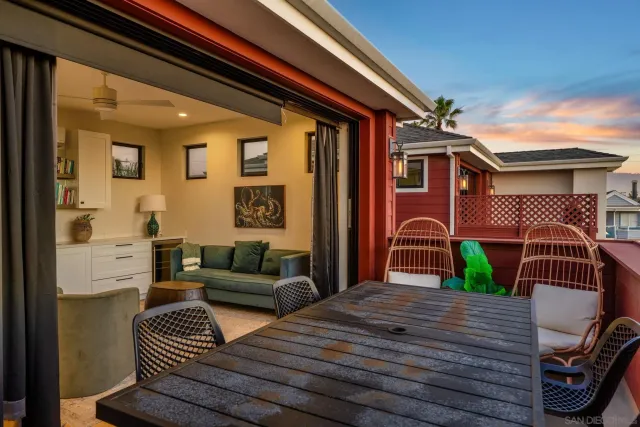 a living room with furniture a flat screen tv and a floor to ceiling window