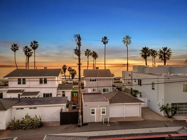 a view of a a dining room with furniture window and wooden floor
