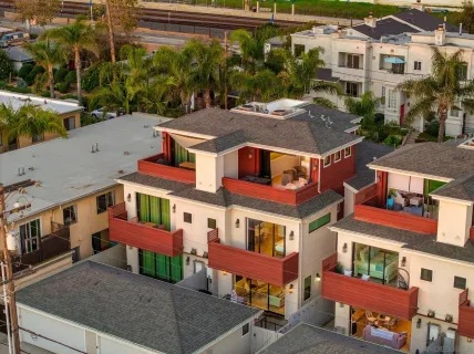 a view of a patio with table and chairs and barbeque with wooden floor
