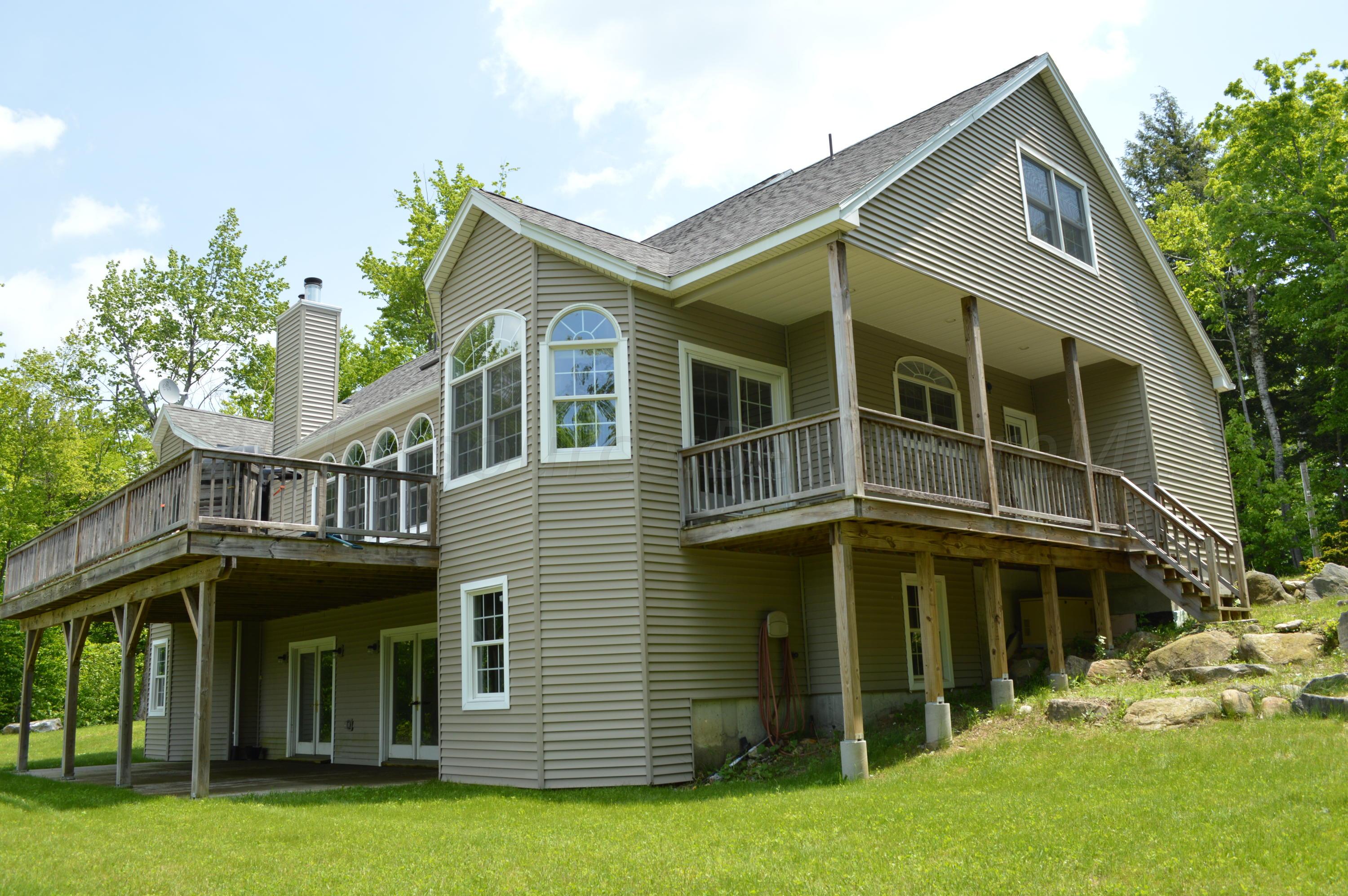 269 Skyline Ridge Road Becket, MA 01223 - Photo 1 of 42 a view of a house with yard